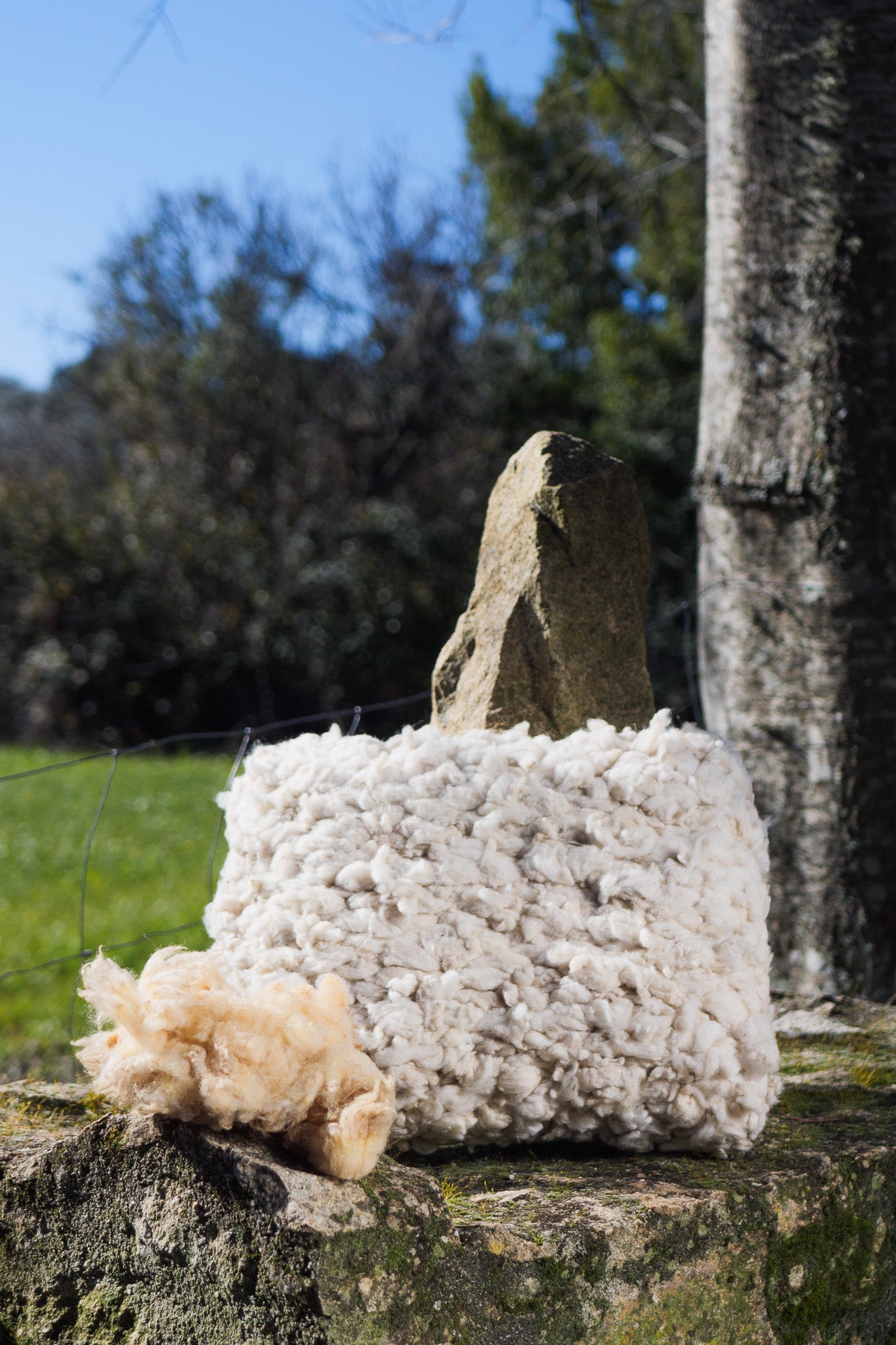 White woven wool cushions with fabric back side