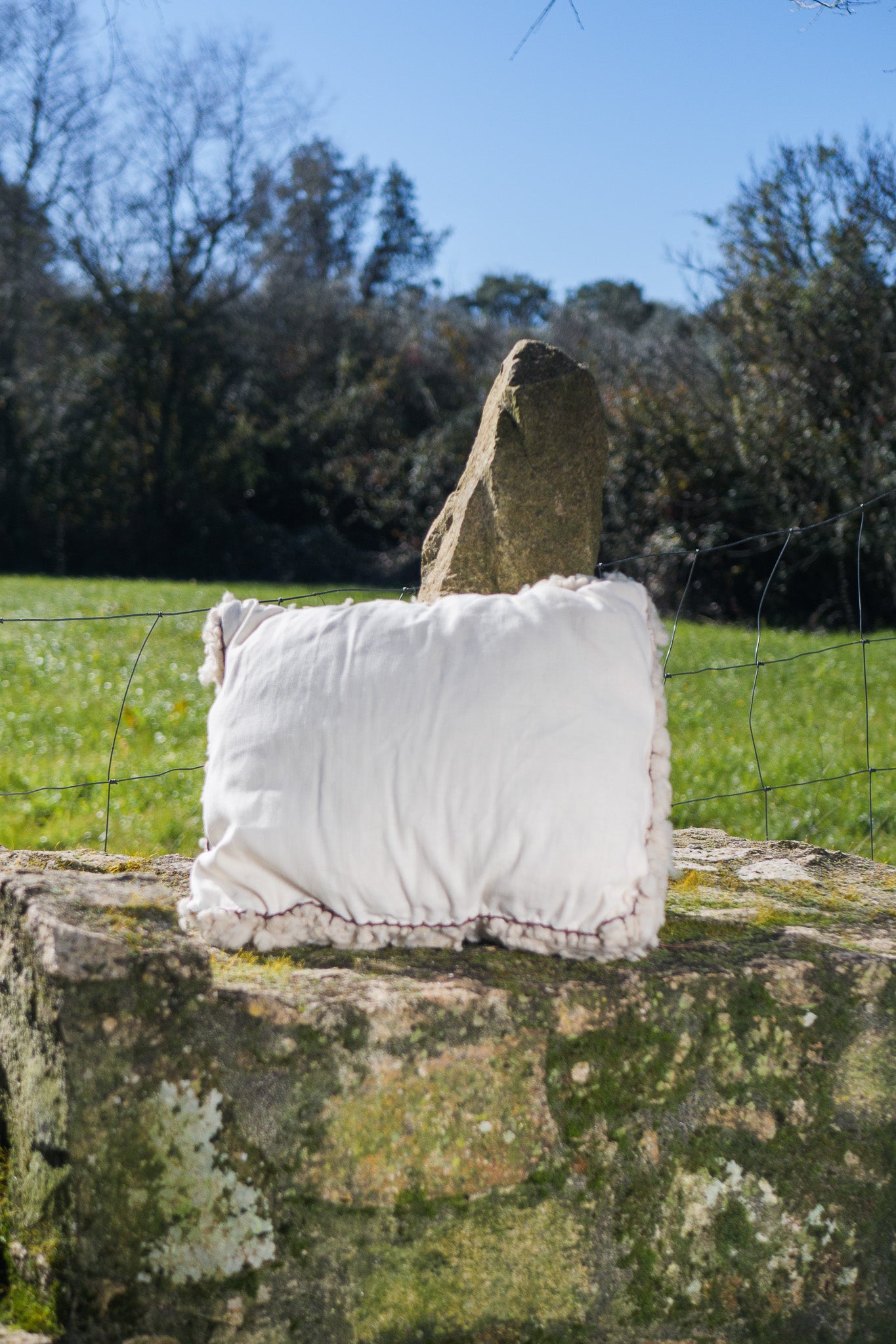 White woven wool cushions with fabric back side