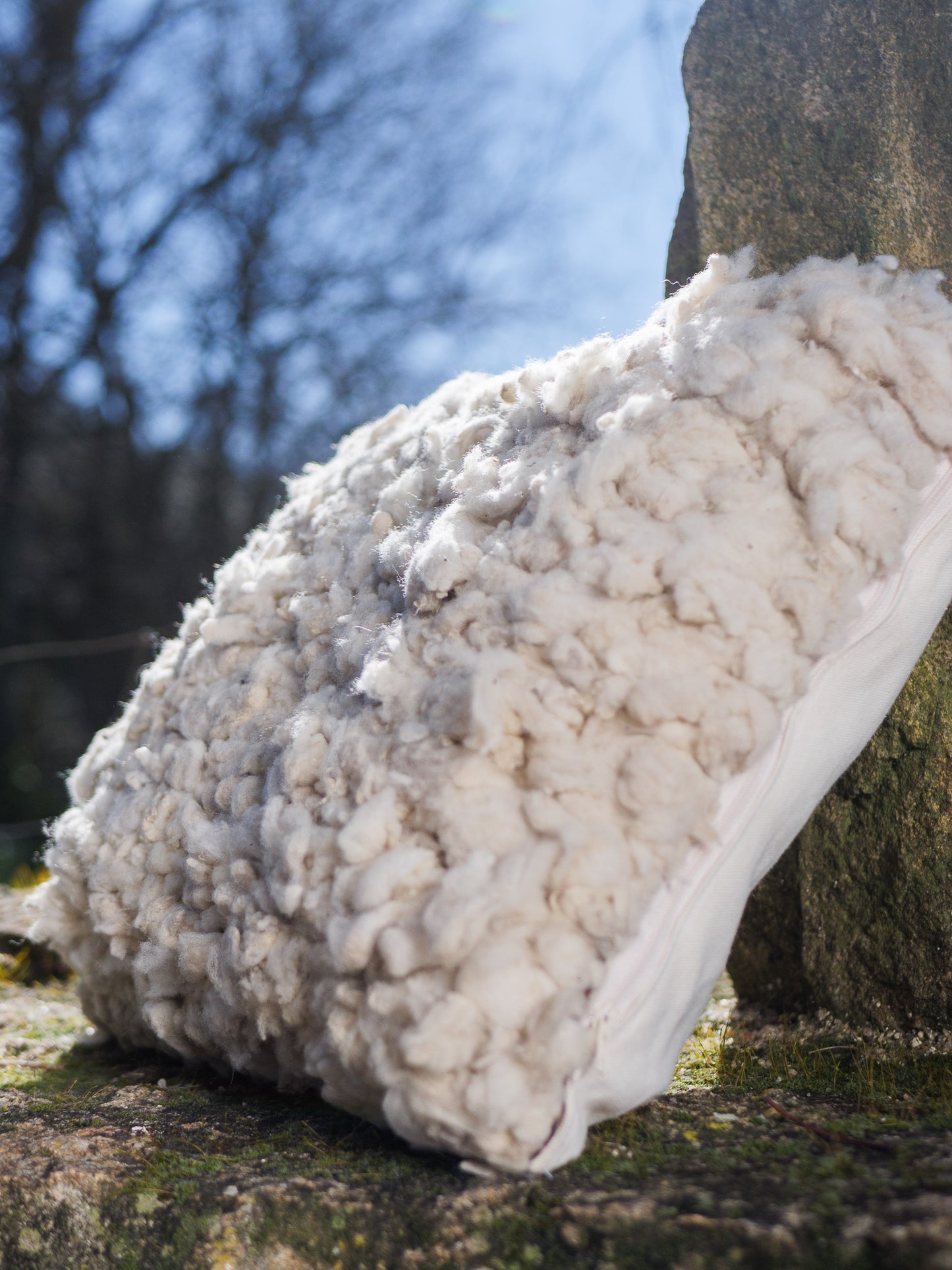 White woven wool cushions with fabric back side