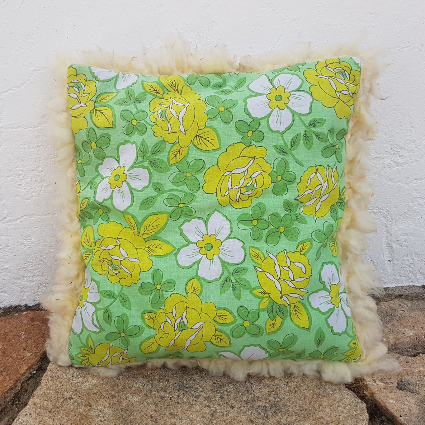 White felted wool cushion with upcycled fabric rear side