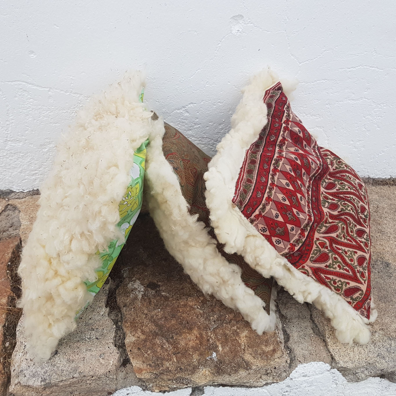 White felted wool cushion with upcycled fabric rear side