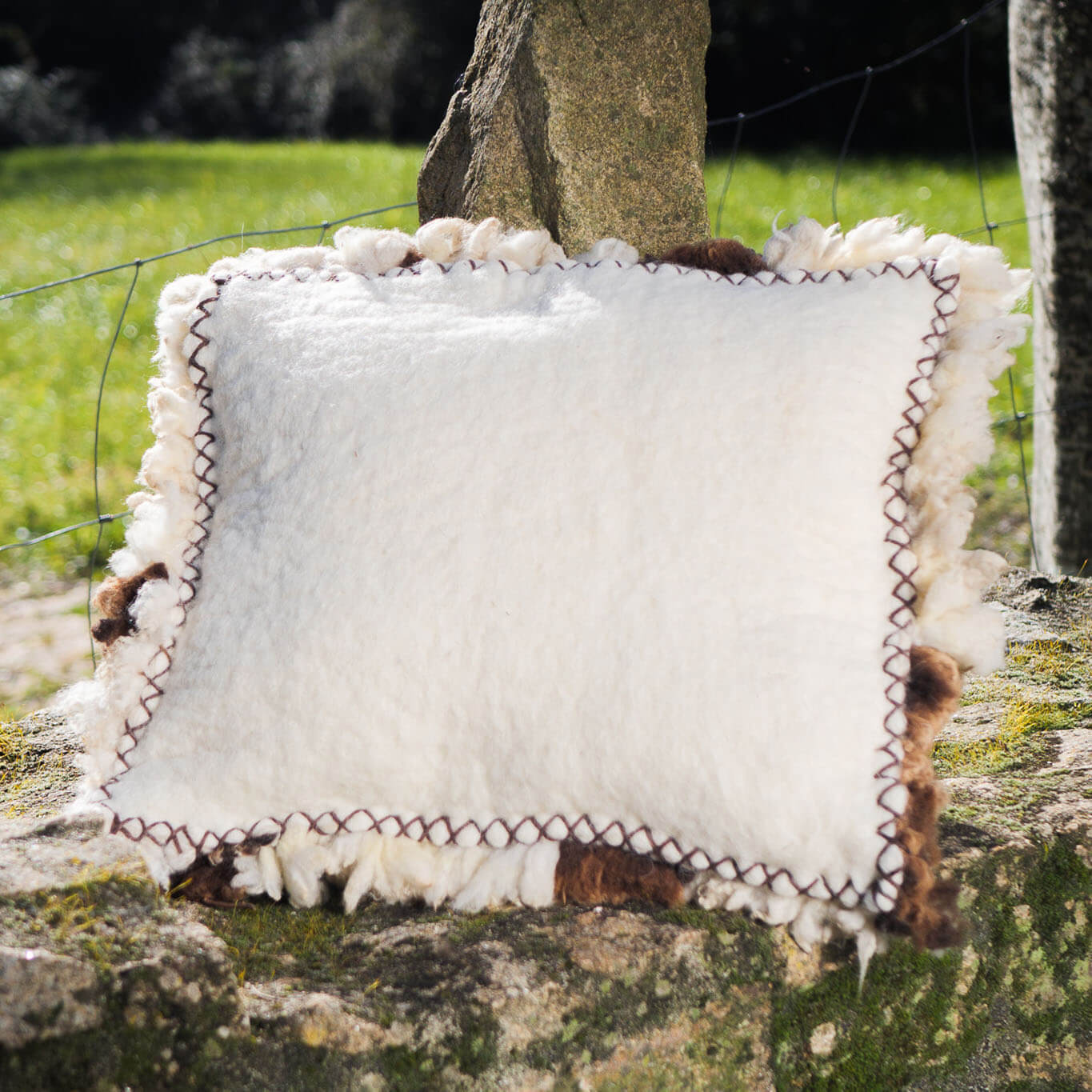 Brown-and-white felted wool cushion