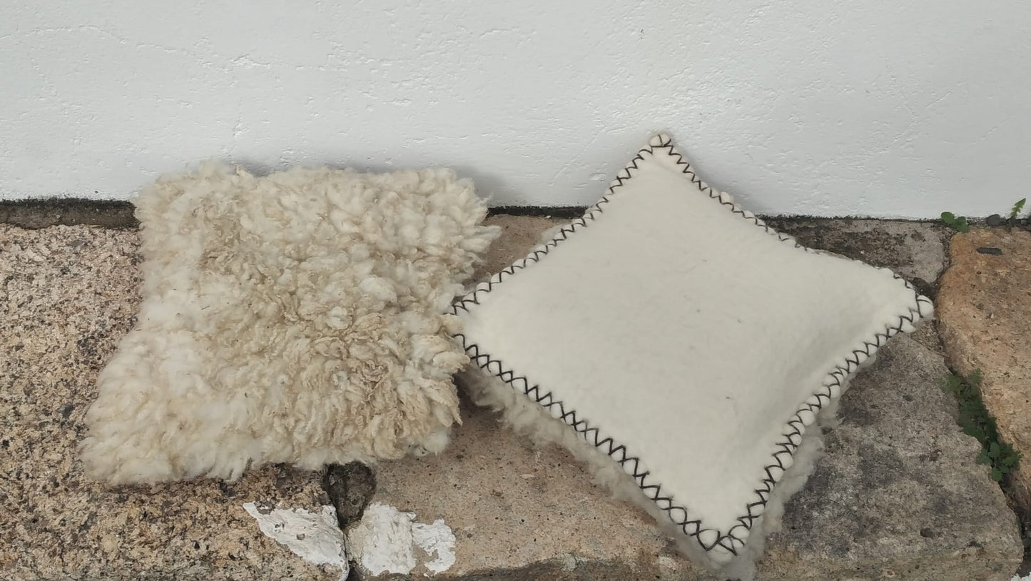 White felted wool cushions